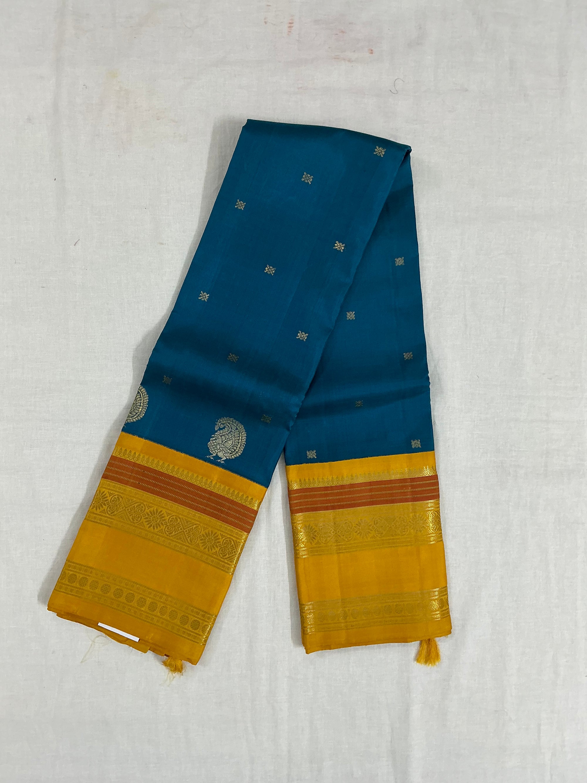 MYTHILI:  PETTU BUTTA KANJIVARAMS (Burnt Copper Sulphate Blue)