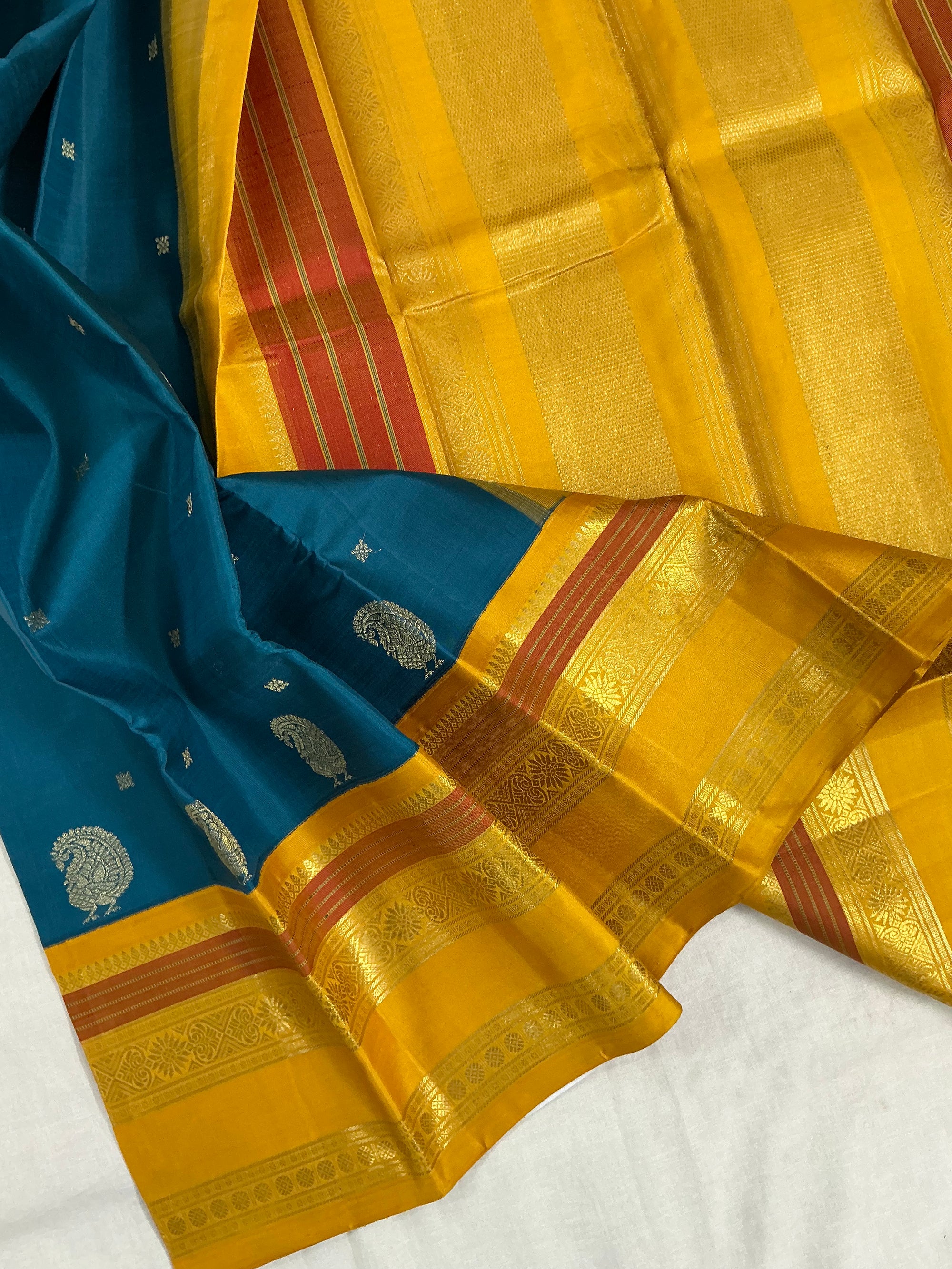 MYTHILI:  PETTU BUTTA KANJIVARAMS (Burnt Copper Sulphate Blue)