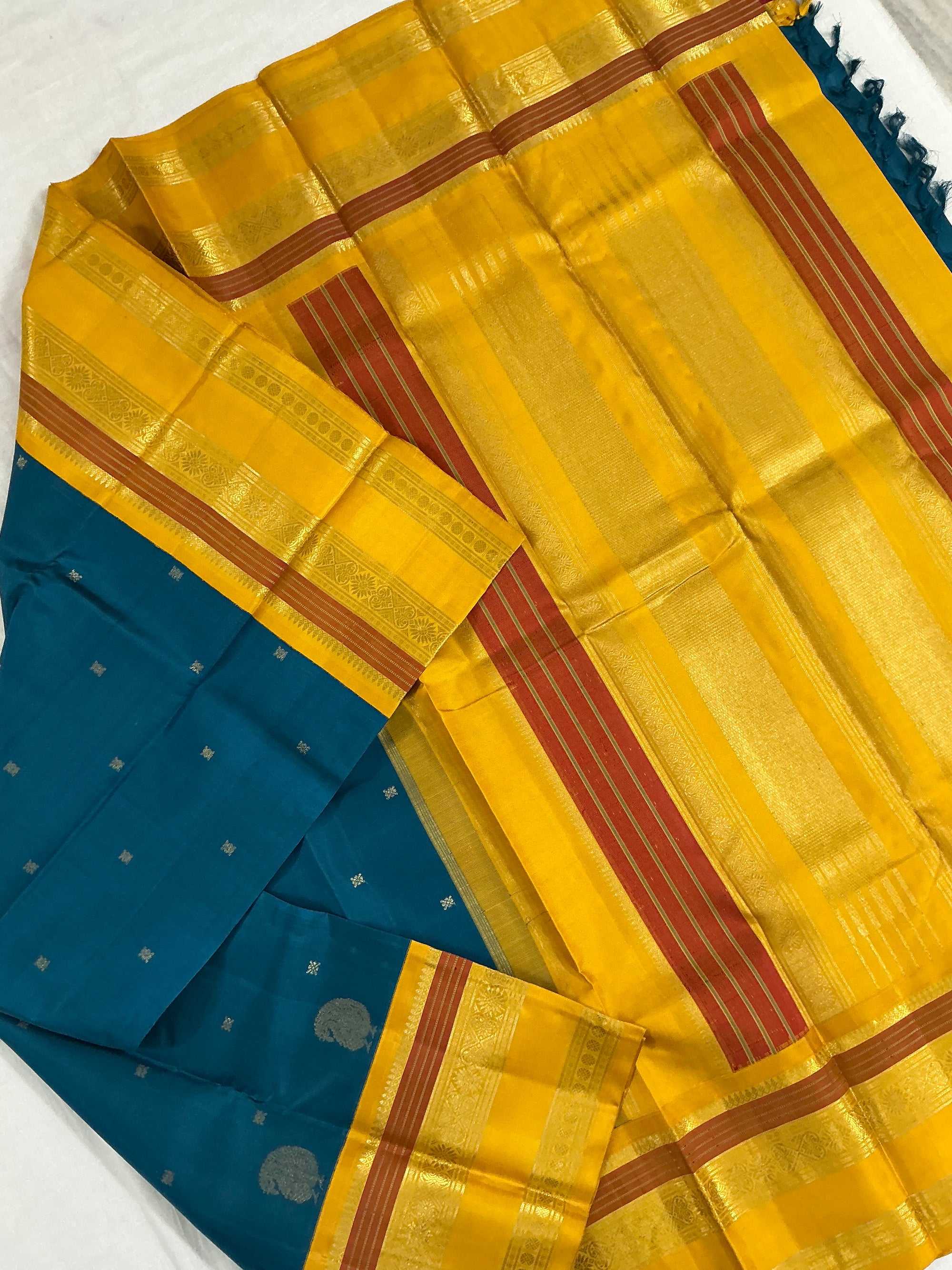 MYTHILI:  PETTU BUTTA KANJIVARAMS (Burnt Copper Sulphate Blue)