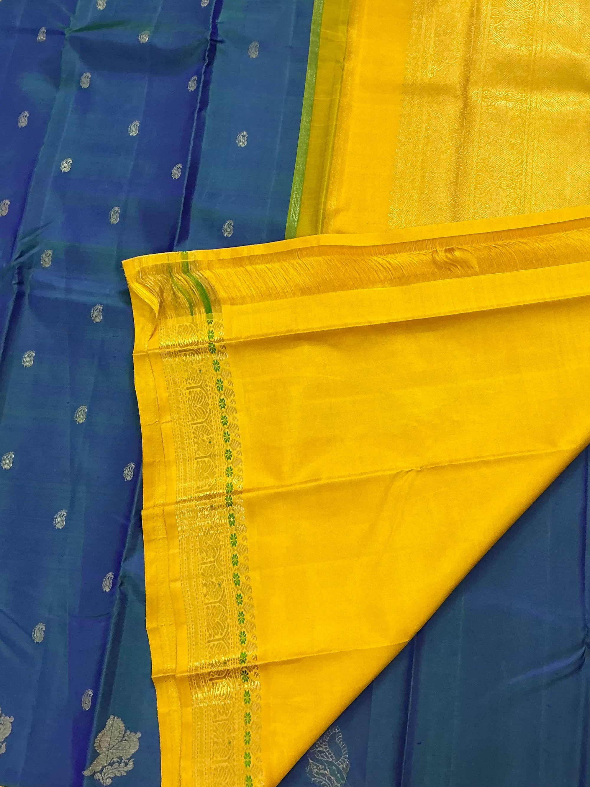 MYTHILI:   Korvai Kanjivaram Silk (Peacock blue with Beetu Buttas)